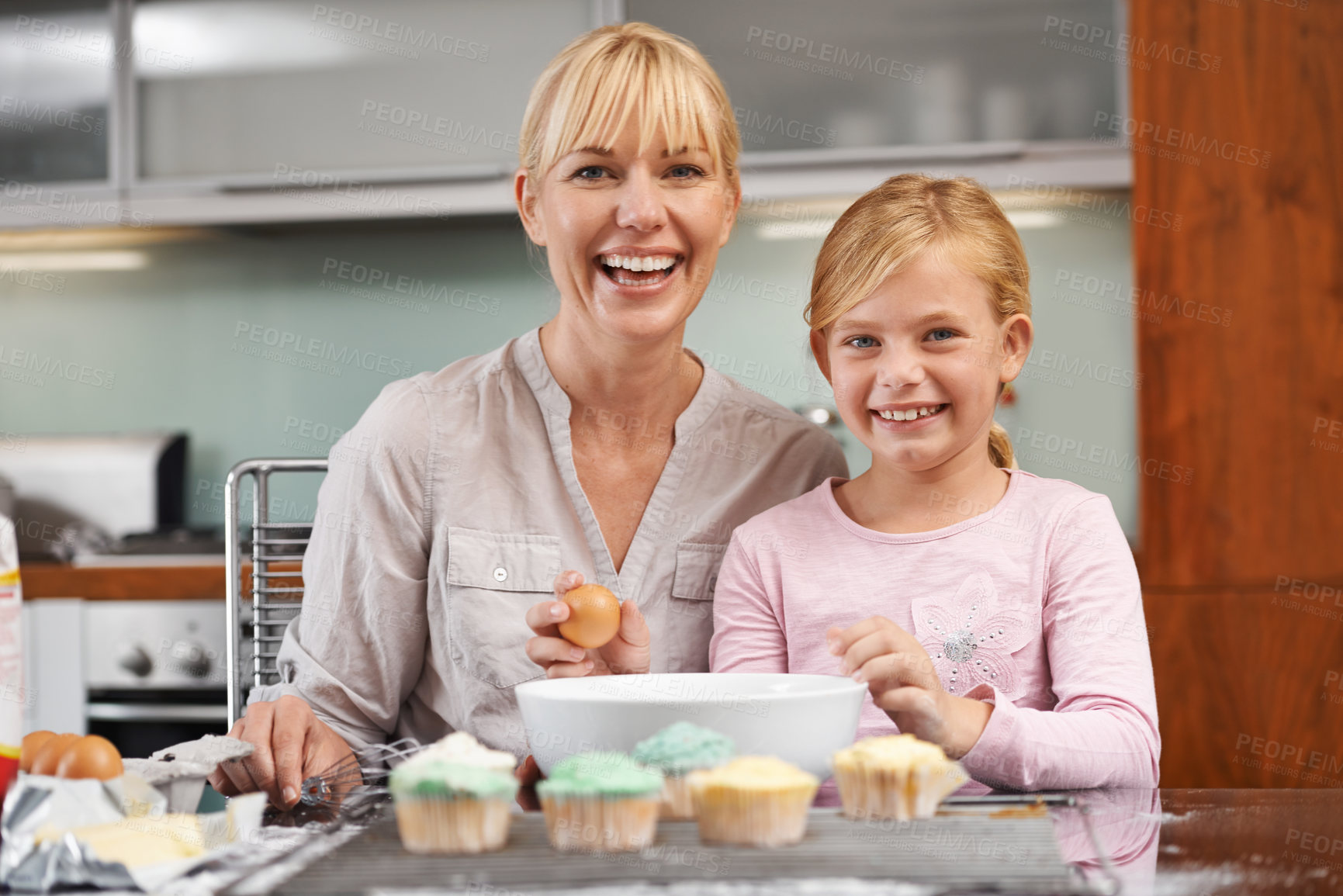 Buy stock photo Baking, children and kitchen portrait with mother and daughter, learning and cooking in home. Smile, family and development of food education, eggs or cupcakes for bonding with young child or parent 
