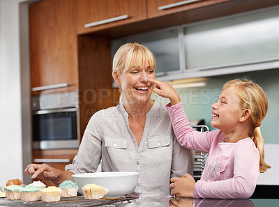 Buy stock photo Mother playing, flour or girl baking in kitchen or happy family with an excited child learning cupcake recipe. Home, daughter or fun mom with muffin, help or smile for teaching kid for development