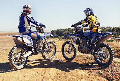 Buy stock photo Rear view, sport or racer on motorcycle outdoor on dirt road with relax after driving, challenge or competition. Motocross, motorbike or dirtbike driver and helmet on offroad course or path at rally
