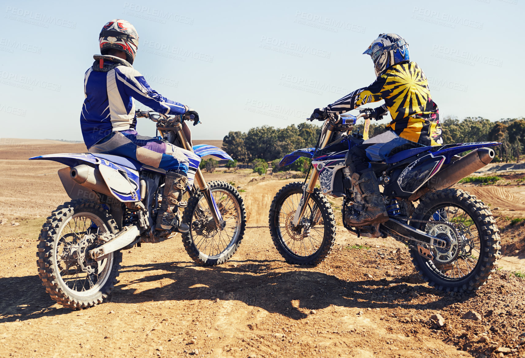 Buy stock photo Rear view, sport or racer on motorcycle outdoor on dirt road with relax after driving, challenge or competition. Motocross, motorbike or dirtbike driver and helmet on offroad course or path at rally
