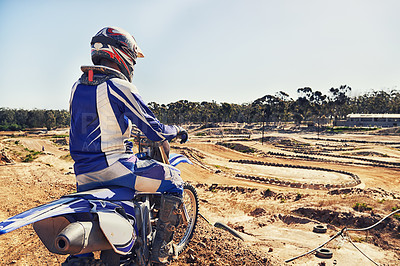 Buy stock photo Person, motorcyclist or expert on dirt track for extreme sports, outdoor competition or race. Rear view of professional rider on motorbike or scrambler for sand course, challenge or off road rally