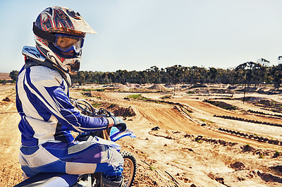 Buy stock photo Portrait, motorcycle and man on a dirt track for action, competition or a sports race outdoor. Ride, bike and power with a male athlete sitting on a motorbike for training, practice or preparation