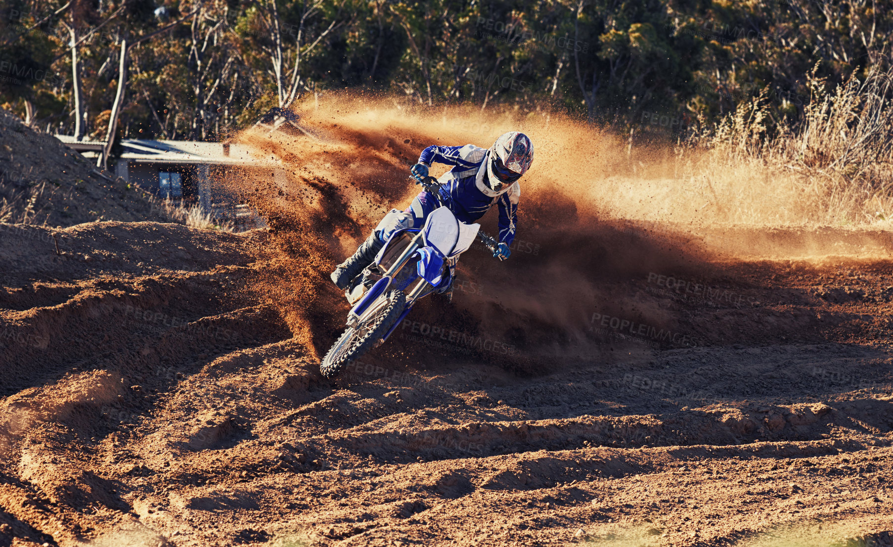 Buy stock photo Person, dirt racer and professional motorcyclist on bike for extreme sports competition on outdoor track. Expert rider on motorbike or scrambler for sand course, challenge or off road rally in nature