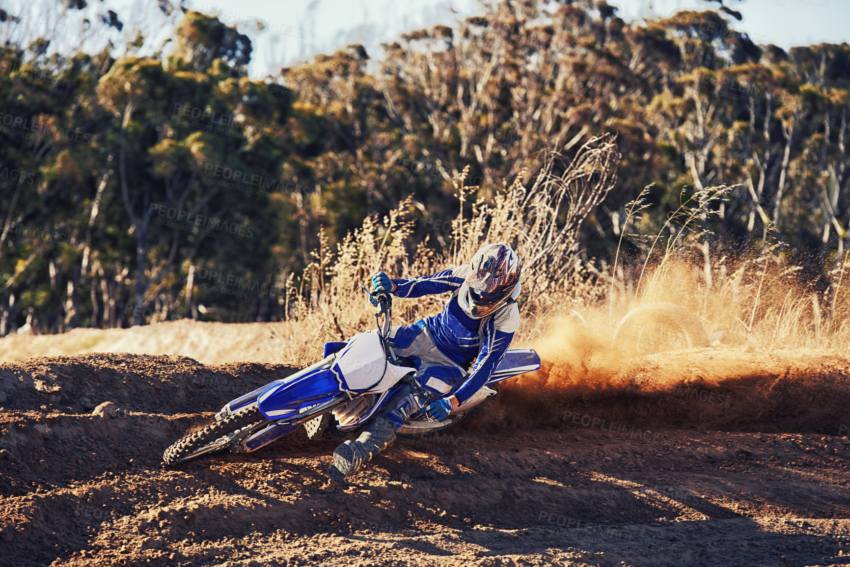 Buy stock photo Person, professional motorcyclist and dirt track for competition, extreme sports or outdoor race. Expert rider on motorbike or scrambler for sand course, challenge or off road rally track in nature