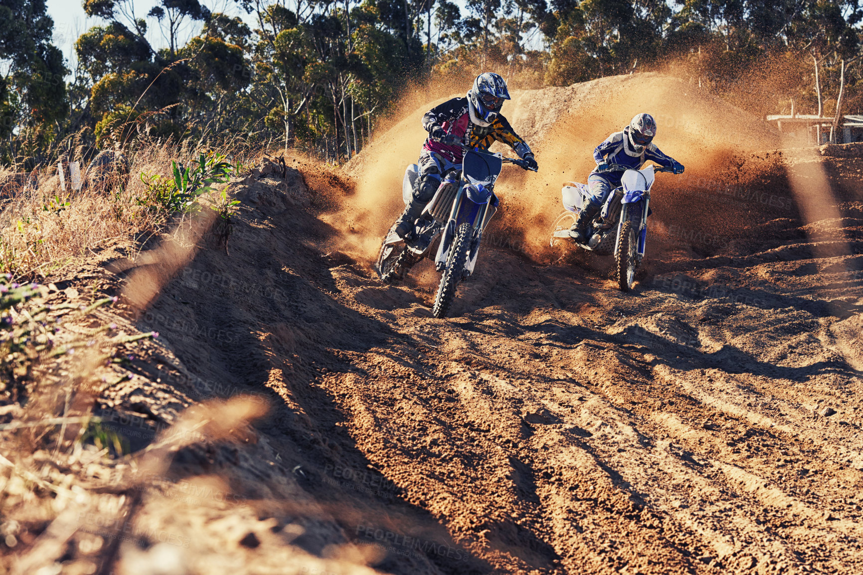 Buy stock photo Shot of two motocross racers in action