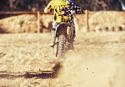 Buy stock photo Person, motorcyclist and dust with dirt bike on track for race, extreme sports or outdoor competition. Rear view of expert rider on motorbike, scrambler or sand course for off road rally challenge