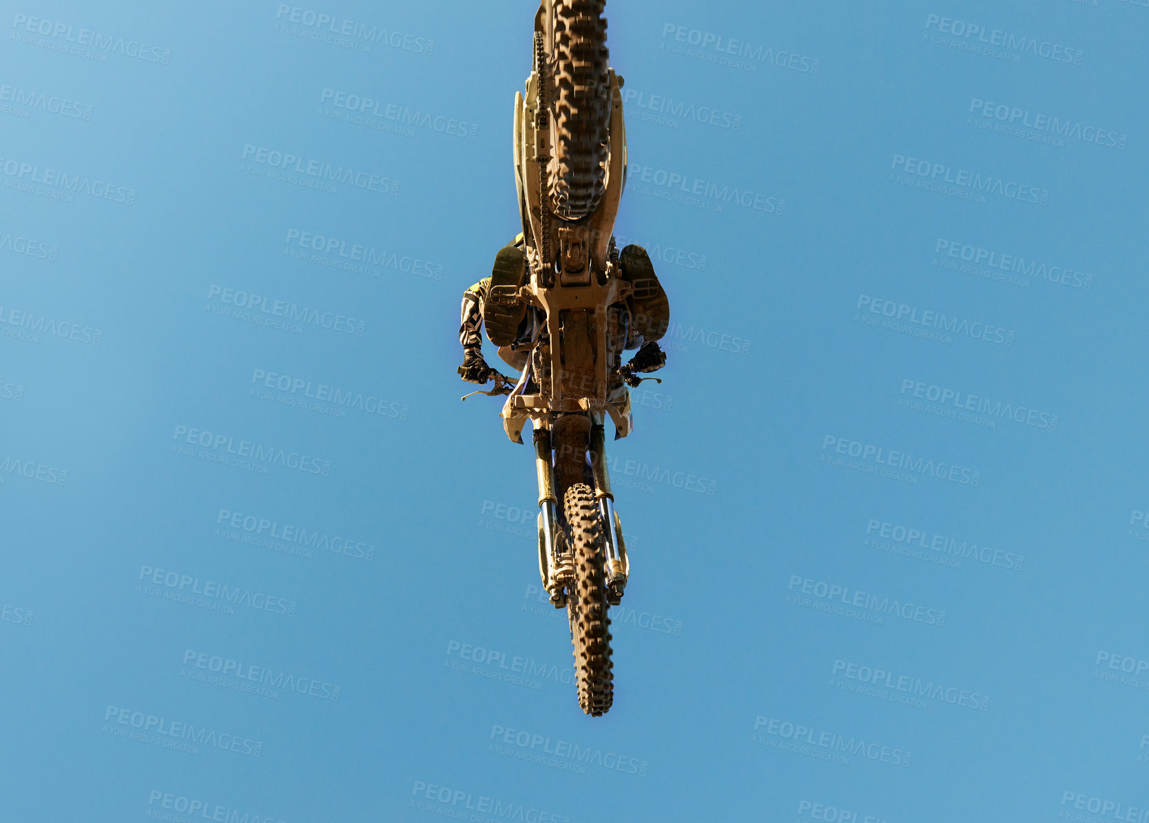 Buy stock photo Motorcycle, jump and person on blue sky mockup with low angle for performance, extreme sports stunt and adrenaline. Competition, fearless and man on motorbike for outdoor challenge and skill.