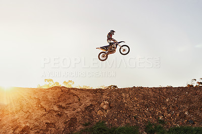 Buy stock photo Person, jump and motorcyclist in the air on mockup with sunset for trick, stunt or ramp on outdoor dirt track. Expert rider on motorbike with lift off for extreme sports or rally challenge in nature