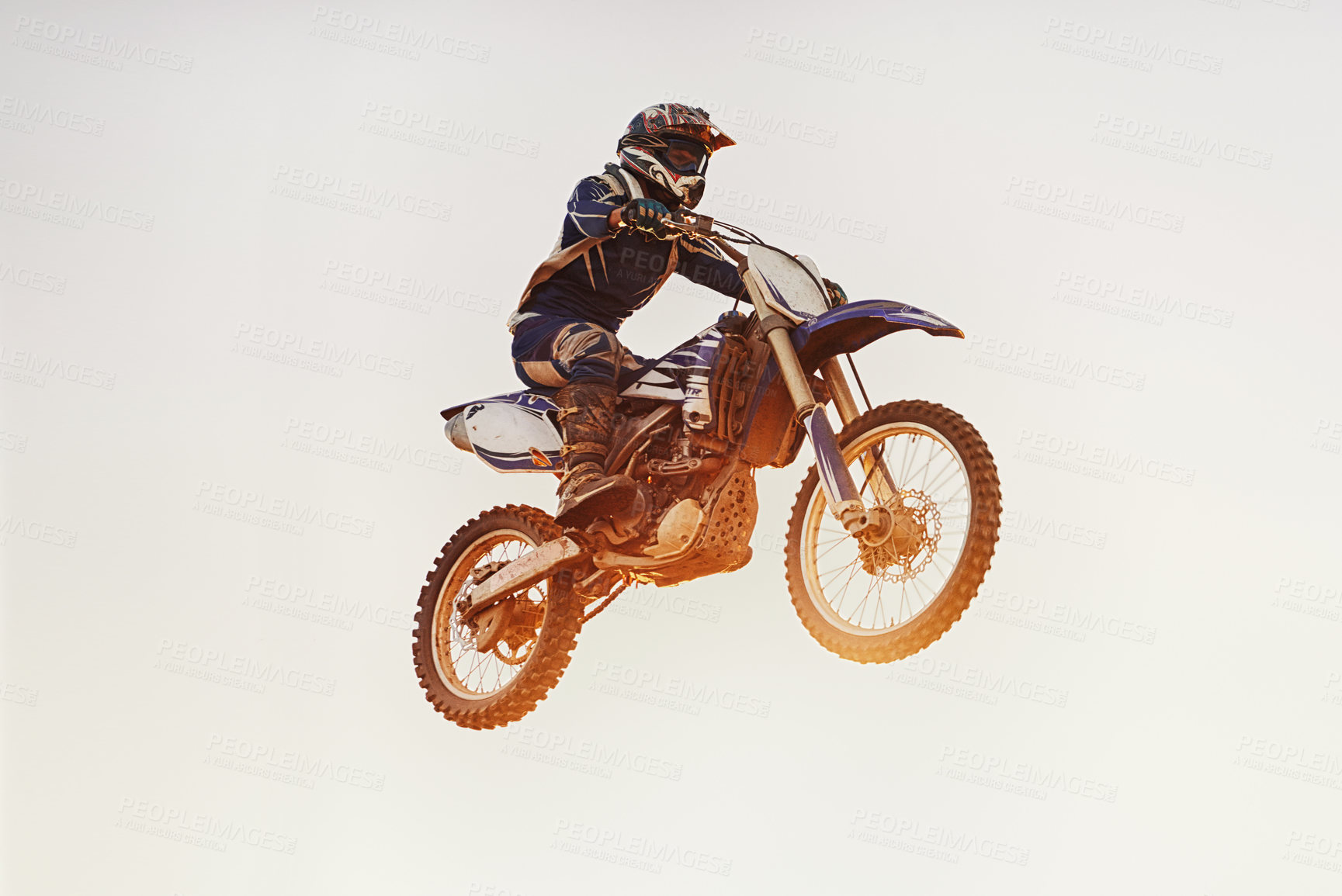 Buy stock photo Person, jump and motorcyclist in the air for extreme sports, trick or outdoor stunt in sunset on mockup. Expert rider on motorbike or lift off for rally challenge, performance or adrenaline in nature