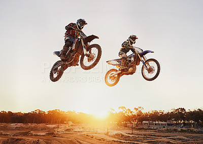 Buy stock photo Motorbike, jump and adventure during race for competition as transportation with sunset. Men, motorcycle and action for sports in the outdoor on fast course with power and moving fast with risk. 