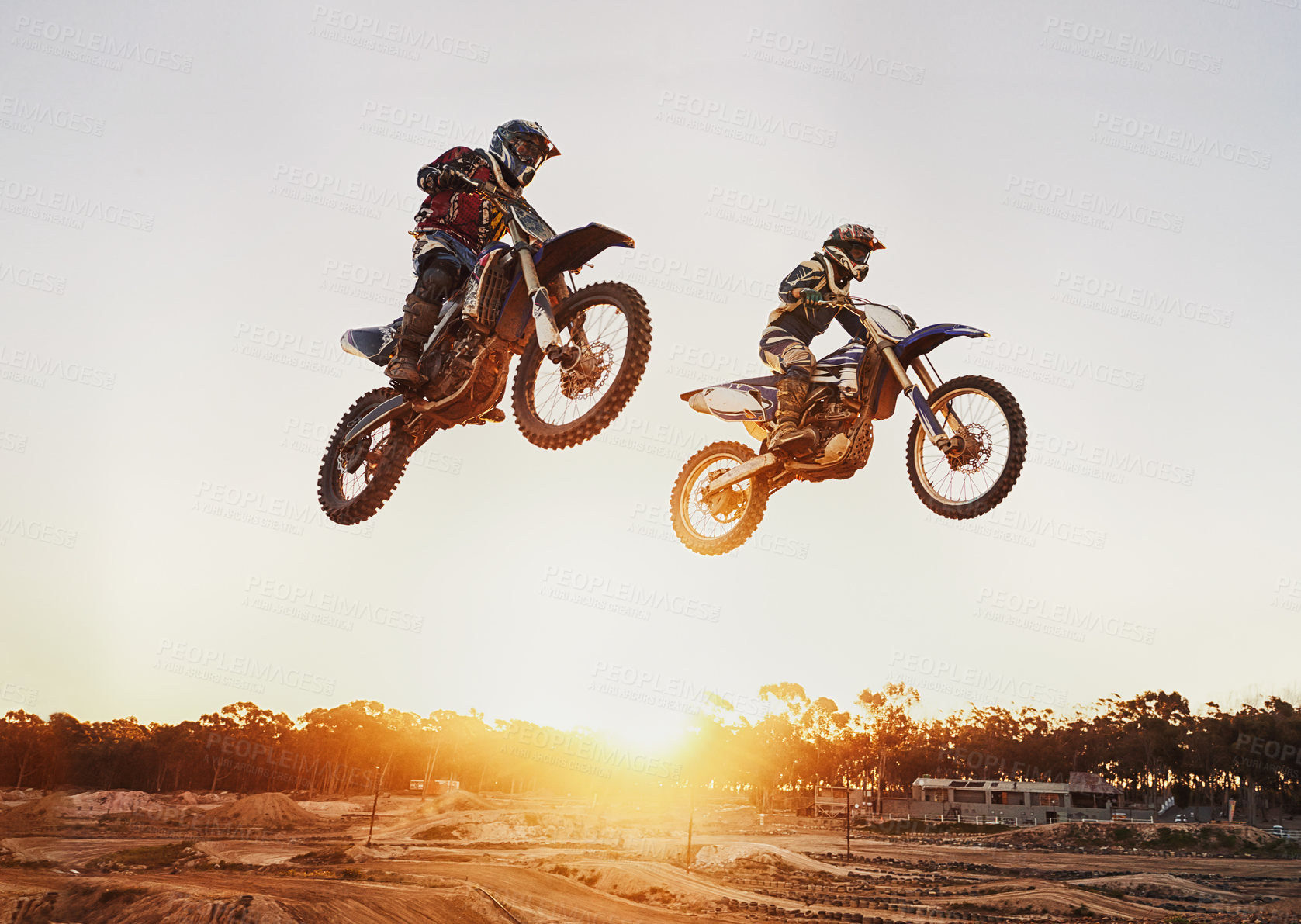 Buy stock photo Motorbike, jump and adventure during race for competition as transportation with sunset. Men, motorcycle and action for sports in the outdoor on fast course with power and moving fast with risk. 