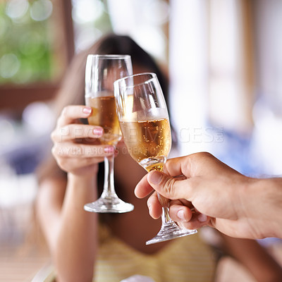 Buy stock photo A happy couple toasting with champagne