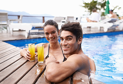 Buy stock photo Swimming pool, cocktails and couple with holiday, portrait and weekend break with vacation and honeymoon. Sunshine, man or woman with tropical drink and wet with luxury or summer with love or alcohol