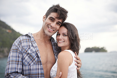 Buy stock photo Portrait, smile and couple at ocean on vacation, holiday or travel together outdoor in Italy. Face, man and happy woman at sea for adventure, care and connection in summer by beach in nature for love
