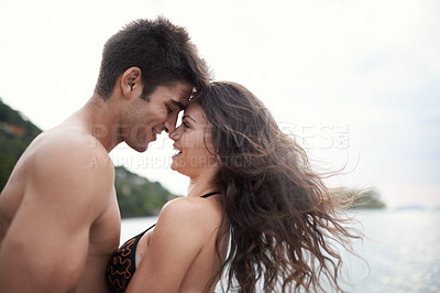 Buy stock photo Couple, forehead touch and travel to ocean on vacation, love and relax by water on holiday. People, swimwear and bonding for relationship in outdoors, support and smile on trip to sea or nature