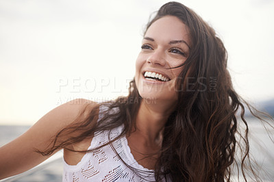 Buy stock photo Shot of an attractive young woman enjoying a boat ride on the lake
