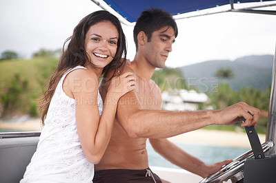 Buy stock photo Couple, boat and driving for lake holiday or explore sea on vacation adventure or sailing, travel or steering wheel. Man, woman and happy in Hawaii or outdoor journey on coast, transportation or trip