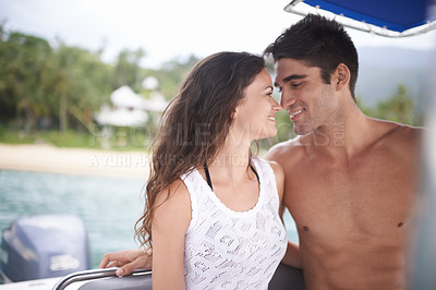 Buy stock photo Couple, love and boat holiday on ocean or tropical island adventure or Hawaii sailing, explore or transportation. Man, woman and lake vacation in paradise for summer dating, traveling or honeymoon