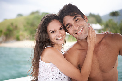 Buy stock photo Portrait, smile and couple at ocean on holiday, vacation or travel together outdoor in Italy. Face, man and happy woman at sea for adventure, care and connection in summer by water in nature for love