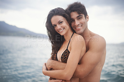 Buy stock photo Portrait, smile and couple at ocean for travel, vacation and holiday together outdoor. Face, man and happy woman at sea for adventure, embrace and connection in summer by water in nature for love