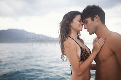 Buy stock photo Love, couple or touch forehead at ocean for vacation, holiday or travel together in summer. Happy man, woman or intimate at sea for connection, care or bonding on adventure by water outdoor on mockup