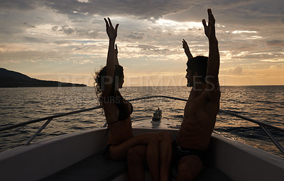 Buy stock photo Couple, freedom and sunset on boat with silhouette, happy with vacation and travel to Italy for the ocean and fresh air. Romantic adventure for love, bonding and excited with arms raised in transport