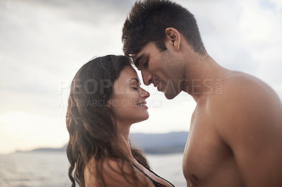 Buy stock photo Love, happy couple and touch face at ocean for vacation, holiday or travel together in summer. Man, woman and intimate at sea for connection, care or bonding on adventure by water outdoor in nature