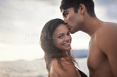 Buy stock photo Portrait, smile and couple kiss at ocean on vacation, holiday or travel together at sunset. Face, man and happy woman at sea for adventure, romance or connection in summer by water for love on mockup