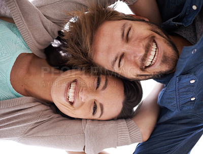 Buy stock photo Happy couple, portrait and hug with love below for support, care or bonding together in nature. Low angle of young man and woman with smile in happiness for embrace, relationship or outdoor holiday