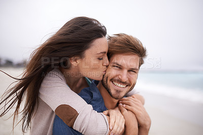 Buy stock photo Woman kiss man, happiness and beach with holiday, travel and love with care and trust outdoor. Freedom, affection and fun with couple in nature, vacation and smile with support and hug by the ocean