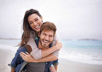 Buy stock photo Love, piggyback and portrait of couple at a beach, hug and laughing while bonding outdoors. Face, embrace and happy man with woman at ocean for travel, freedom or vacation, holiday or Florida trip