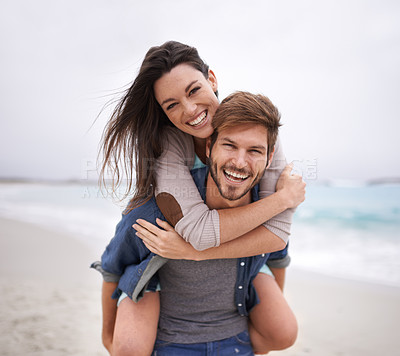 Buy stock photo Couple, portrait and piggyback hug at beach for travel, romance and freedom together outdoors. Face, smile and happy woman embracing man on trip, vacation or holiday, bond and having fun in Florida