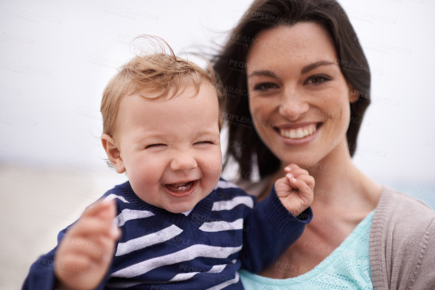 Buy stock photo Happy mother, portrait and beach with baby for fun bonding, holiday or outdoor weekend together in nature. Face of mom, little boy or toddler with smile for love, care or support by the ocean coast