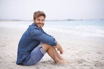 Buy stock photo Portrait, beach and man with a smile, holiday and summer vacation with weekend break and water. Waves, face and person with happiness and guy with seaside and travel with journey or wind with nature