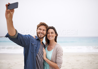 Buy stock photo Love, selfie and couple hug at beach for travel, photo and freedom outdoors together. Smile, embrace and traveling influencer people live streaming for blog, followers or social media profile picture