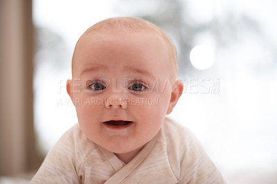 Buy stock photo Shot of a cute and adorable baby boy at home