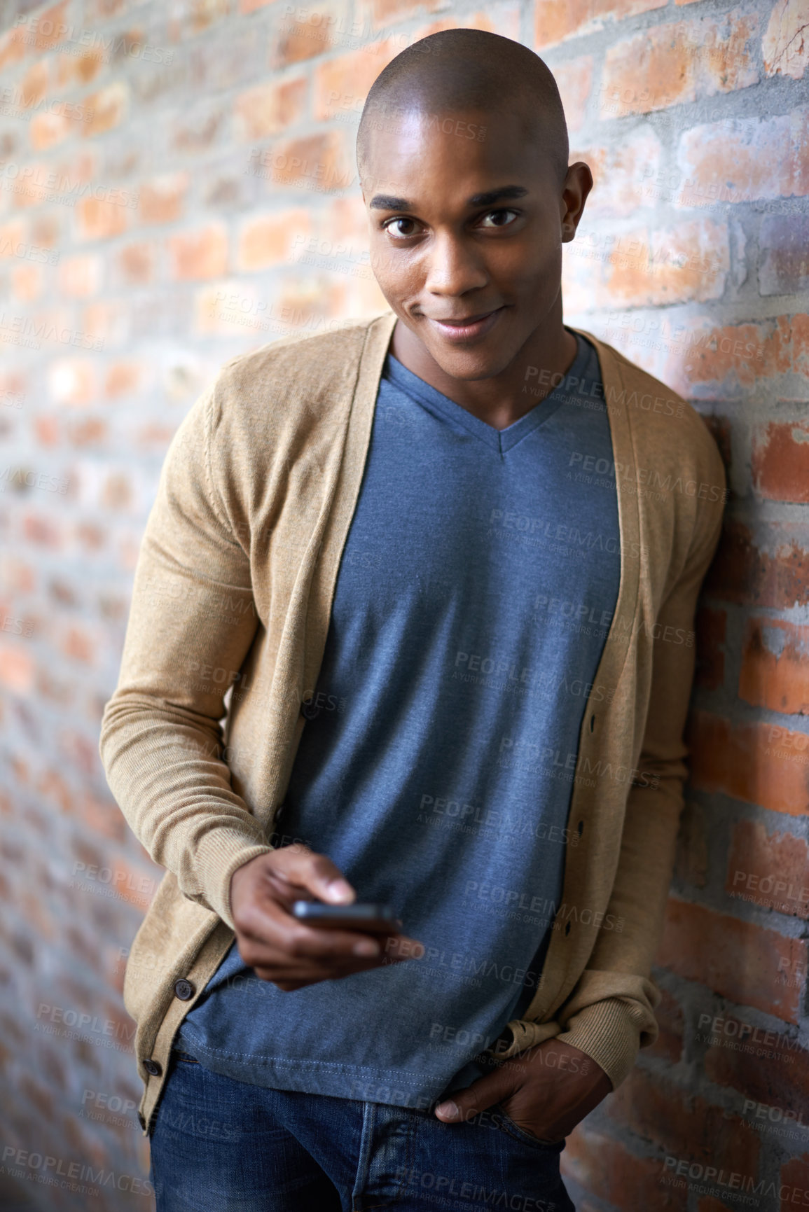 Buy stock photo School, phone and portrait of black man at brick wall for social media, technology or internet. Education, learning and scholarship with student at university for connection, contact or text message