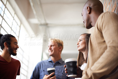 Buy stock photo Coffee, talking and friends or students in a college hallway for discussion, happiness and a drink. Group of diversity men and women at campus or university for a chat or conversation about education