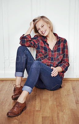 Buy stock photo A portrait of a beautiful young woman sitting on a wooden floor at home