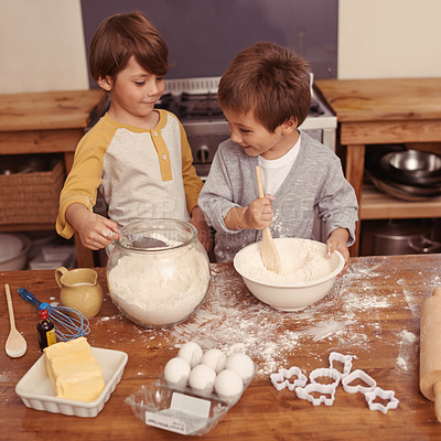 Buy stock photo Shot of al little boys baking in a kitchen