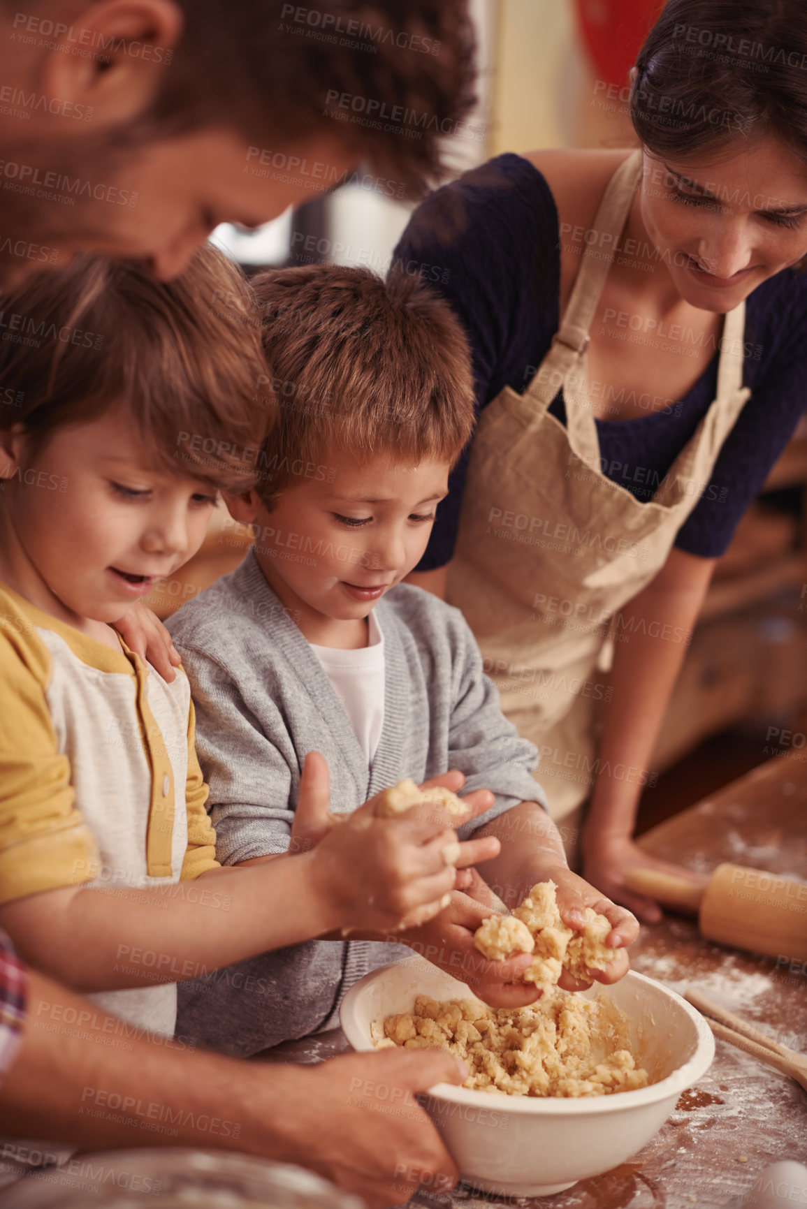 Buy stock photo Happy family, learning and baking in kitchen with cookie dough, home and support for cake with love. Parents, teaching and kids for biscuits on table, care and bonding together on vacation in house