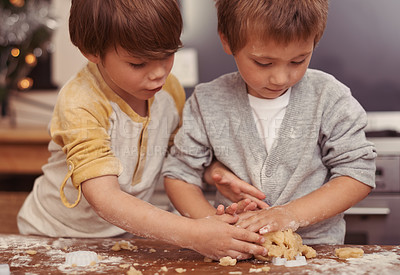 Buy stock photo Boys, cutter and baking in kitchen with dough, home and learning to bake a christmas cake. Children, playing and shape for cookies on counter, biscuits and wheat pastry for sweet dessert on holiday