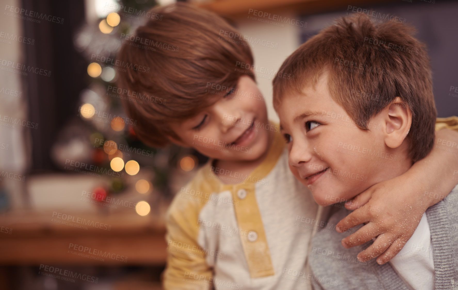 Buy stock photo Happy children, hug and together for christmas in home, bonding and playing with love on holiday. Boys, siblings and excited with social or talking, care and embrace for family on vacation in house 