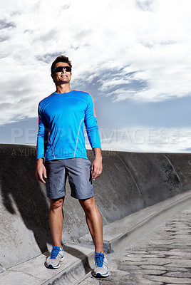 Buy stock photo Man, road and ready for run in outdoors, confident and athlete for performance training. Happy male person, full body and sunglasses for workout on street, cardio and prepare for exercise or fitness