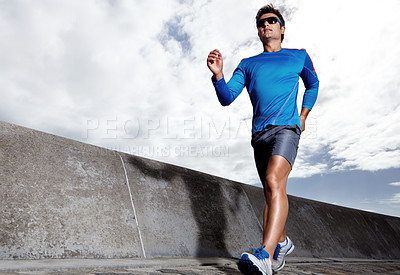 Buy stock photo Man, road and active for running outdoors, sports and athlete for performance training in city. Male person, full body and sunglasses for workout on street, cardio and challenge or exercise by jog