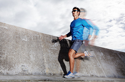 Buy stock photo Motion blur, workout and athlete running on road for energy, exercise and practice for marathon in city. Mock up, male person and runner in street for cardio of speed for sports and wellness