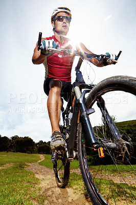 Buy stock photo Nature, cycling and man athlete with bicycle in park for marathon, race or competition training. Fitness, sports and male cyclist riding bike for cardio workout or exercise in outdoor forest.
