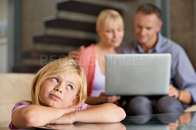 Buy stock photo Thinking, child and parents in lounge with love, relax and laptop for movie on weekend in house. Happy family, rest or daughter with fun idea on holiday or home with streaming of online subscription