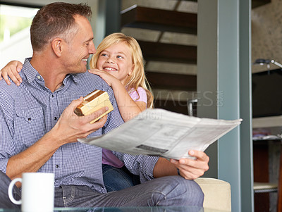 Buy stock photo Shot of a young girl giving her father a surprise gift