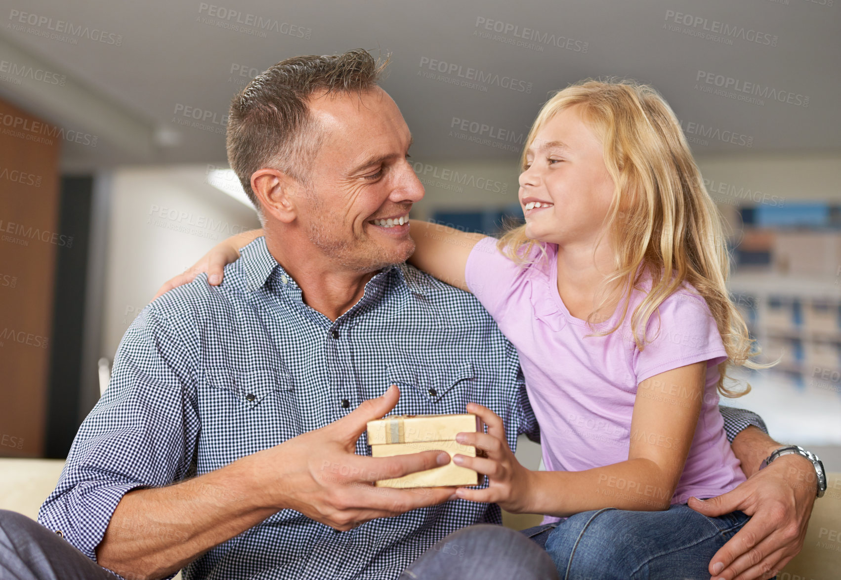 Buy stock photo Hug, father and child with present in home on birthday or giving a box for special event. Family, gift and offer dad package and embrace to show gratitude, love or kid with kindness in living room